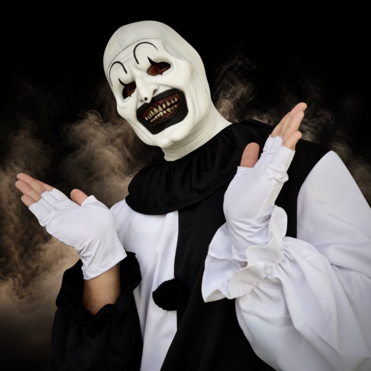 Creepy mime clown halloween mask worn with fingerless gloves and a ruffled collar